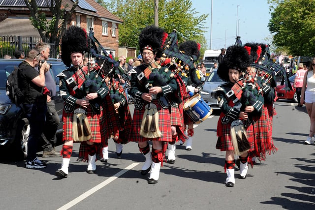 There was no shortage of entertainment, as a troupe of bagpipe players serenaded the crowds heading through the town centre. Picture: Steve Riding.