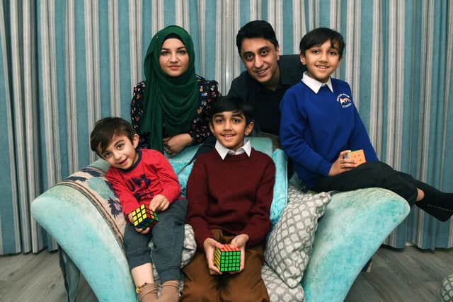 Yusuf Shah with brothers Zaki and Khalid, mother Sana and father Irfan. Picture: Jonathan Gawthorpe