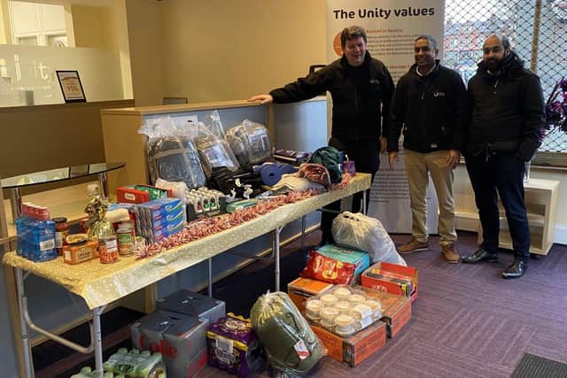 From right to left: Shahzad Ahmed, Rajesh Chaukria and Chris Whittaker with Unity’s Christmas appeal