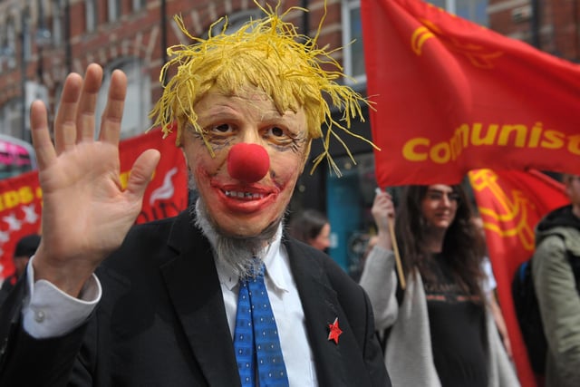 A campaigners wearing a Boris Johnson mask was amongst the many calling for improved pay.