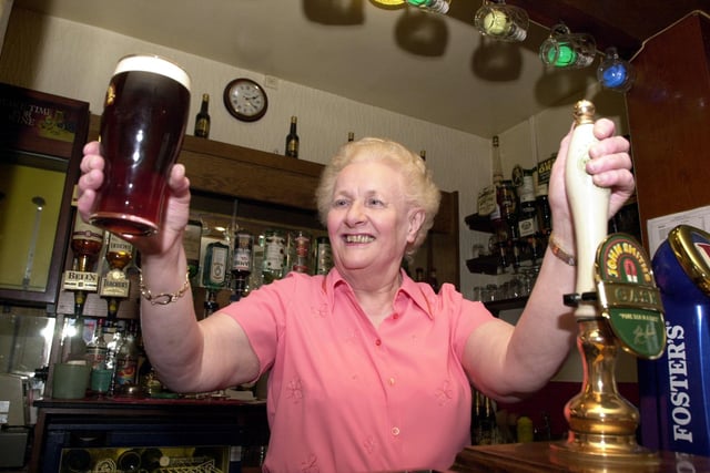 Adele Perkins pulls her last pint at the Royal Oak at Aberford before retiring in March, 2002.