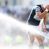 Tom Holroyd uses Headingley's sprinkler system to cool down after last week's win over Warrington. Picture by John Clifton/SWpix.com.