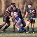 Hunslet's Ethan O'Hanlon, Harvey Hallas and Cam Berry tackle a Lock Lane opponent during the sides' Challenge Cup clash. Picture by John Victor.