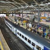 Passengers board trains at Leeds train station. (Pic credit: Alex Cousins / SWNS)