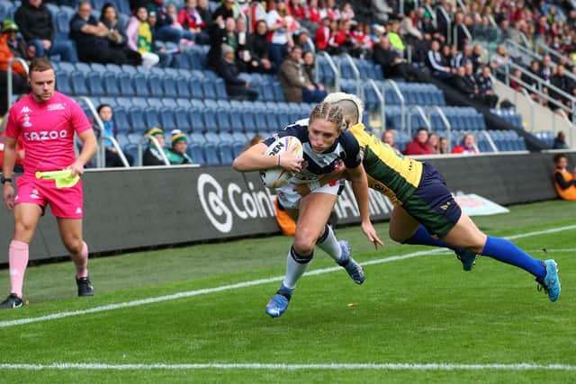 Caitlin Beevers crosses for England's first try against Brazil. Picture by Alex Livesey/Getty Images for RLWC.