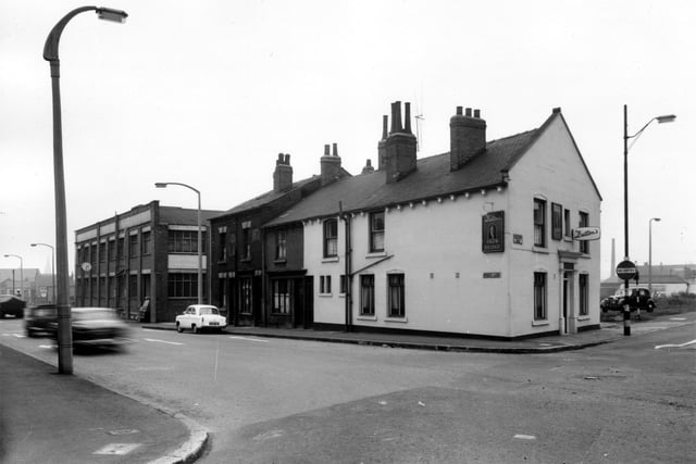 Gelderd Road along Spence Lane in the direction of Whitehall Road in March 1965. On the left is the premises of J. and H. Smith Ltd, builders hardware and machinery merchants. This is Corner House on Whitehall Road. Moving right is the Skew Bridge public house on Gelderd Road.