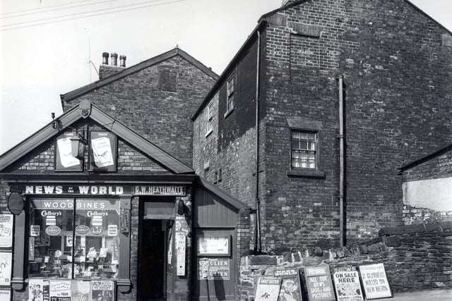 A newsagents and tobacconist on Branch Road in 1958. Several newspaper billboards can be seen towards the right including a Daily Mail story featuring Pope John XXIII who was appointed in 1958 and a Yorkshire Post headline. 'Three Climbers Killed on Ben Nevis'.