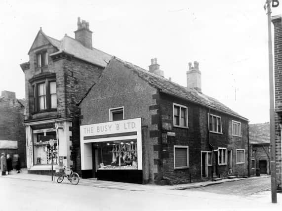 Lower Town Street showing the entrance to Patchett's Place, right. The two shop properties are, left, William Lax, Newsagent, at number 162 and right, Busy 'B' Ltd, Butchers, at number 160. Number 162 had been the location of Bramley Post Office since 1854. In 1892 Mr. J.W. Dawson took over the position of Post-master from his father and by the turn of the century it had become a thriving business. In 1902 600,000 letters were delivered and 7,000 telegrams and there was a turnover of £20,000. 8 postmen were making 3 daily deliveries in Bramley from this office. In the photograph parked in front of the Busy 'B' is the errand boy's bicycle with its large basket at the front for delivering the meat orders to homes within the community.