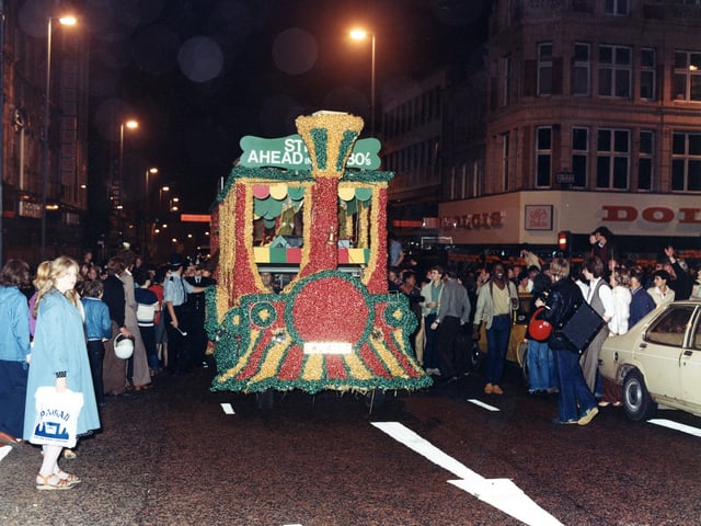 The American Western style steam engine is just passing the junction with Albion Place where Dolcis Shoe Shop is located at the corner.