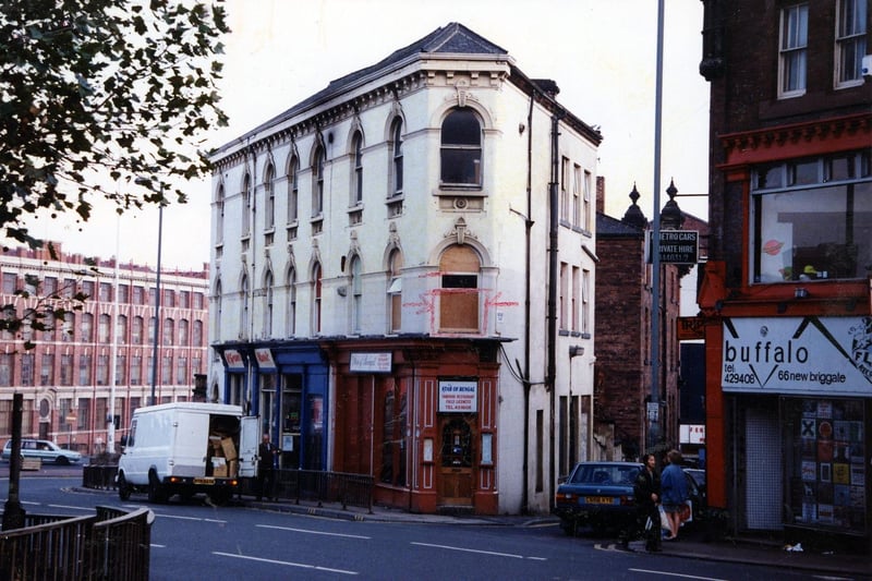 New Briggate in November 1990. On the right is Buffalo Menswear, then Star of Bengal, tandoori restaurant, and McGranes musical instruments.