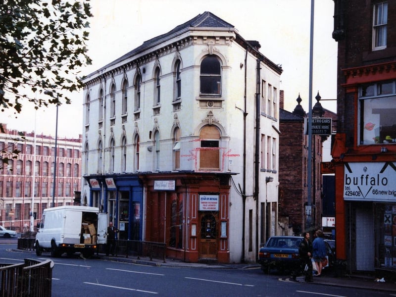 New Briggate in November 1990. On the right is Buffalo Menswear, then Star of Bengal, tandoori restaurant, and McGranes musical instruments.
