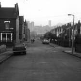 Chapeltown's Mexborough Place, looking south towards the city centre, visible in the distance. On the left is the junction with Mexborough Street, and further streets of terraced houses can be seen leading off to the left. These are Mexborough Drive, Savile Place, Savile Road, and Savile Drive.