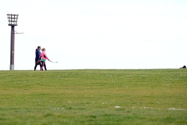 We were all encouraged to take our permitted exercise time, like this couple on The Headland in April 2020.
