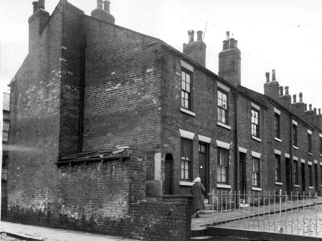 Acton Street from the junction with Maitland Place in July 1964. Most of the streets which join Maitland Place have railings to help ensure the safety of children playing outside their homes and discourage them from venturing on to busier roads.