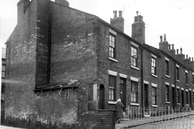 Acton Street from the junction with Maitland Place in July 1964. Most of the streets which join Maitland Place have railings to help ensure the safety of children playing outside their homes and discourage them from venturing on to busier roads.