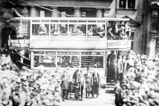 The official opening of the Morley Tramway route which took place on July 5, 1911. The number 238 tramcar, seen in the background was driven by the Mayor of Morley, Alderman Sam Rhodes, on this special occasion. He is seen in long robes in the centre of the group. To the right of him, also wearing his chains of office and a top hat, is the Lord Mayor of Leeds, William Middlebrook. He was also a Morley man and M.P. for South Leeds. Both men took turns in driving the tram. The tramcar was one of 12 Dick Kerr cars following a numbering sequence from 237 to 248. They all had a brown and yellow livery.