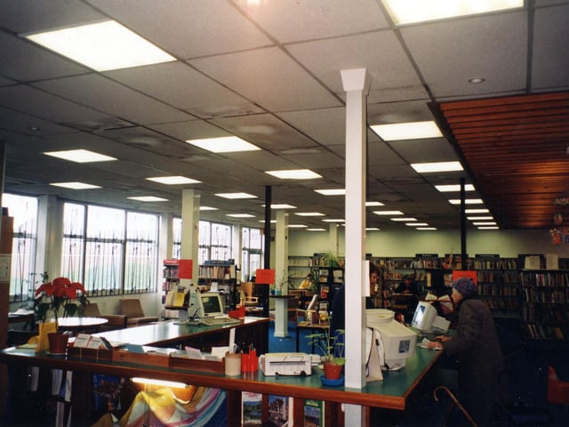 Inside Beeston Branch Library located in the grounds of Hugh Gaitskill School on St. Anthony's Drive. The library was built in the early 1970's. This view shows the counter area, and the presence of computers for issuing and discharging books after a major refurbishment of the library in 1997.