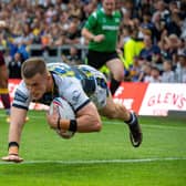 Ash Handley scores the third of Rhinos' nine tries in their morale-boosting win over Huddersfield. Picture by Bruce Rollinson.