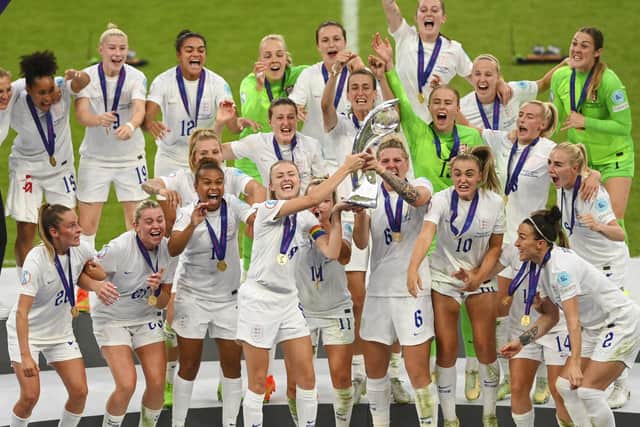 England captain Leah Williamson lifts the trophy with team mates after winning the UEFA Women's Euro 2022 final match between England and Germany (Photo by Michael Regan/Getty Images)