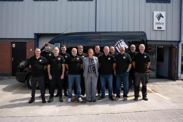 The Zebra Print Group team, led by managing director, Samantha Overton (centre)