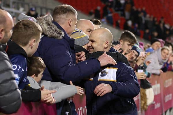 Coach Rohan Smith is congratulated on Rhinos' win by club director Rob Oates and travelling fans. Picture by Paul Currie/SWpix.com.