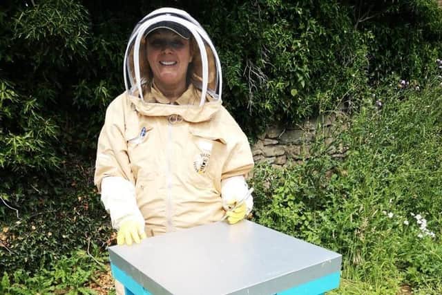 Entrepreneur Claire Tolley said that beekeeping gives her "a feeling like no other".