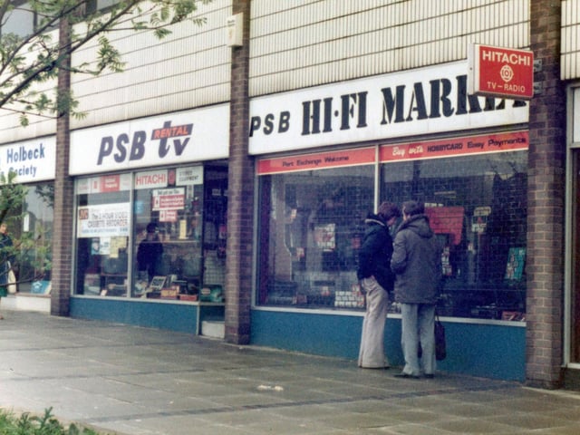 Selby Road showing PSB Rental and TV Shop on the south side of Selby Road. The parade of shops was redeveloped and is located opposite Milestone Yard.