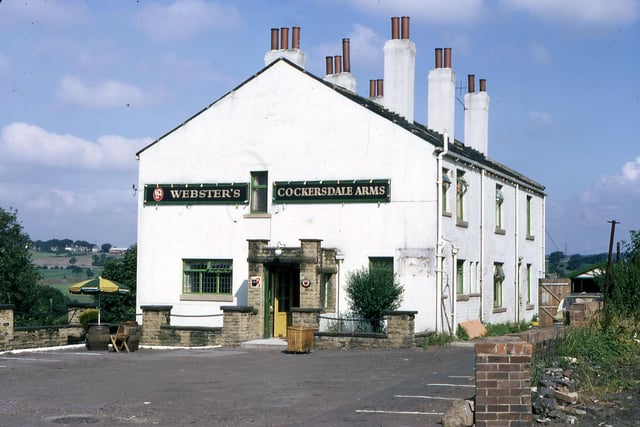 Cockersdale Arms, a Webster's public house on Whitehall Road. The pub was formerly known as the Gashouse Tavern and it reverted back to this name in 2005. Originally there were three houses on the right hand side of the pub which were occupied until the 1950s before being demolished. The building has more recently been extended and converted into flats which have retained the name Gashouse Tavern. David Atkinson Archive