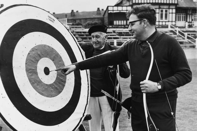 Leeds's own Martin Seeber points to the spot where his arrow landed to win him the Scorton Silver Arrow contest in Jun e 1971. The oldest competitor, 90-year-old Ben Hird looks on.