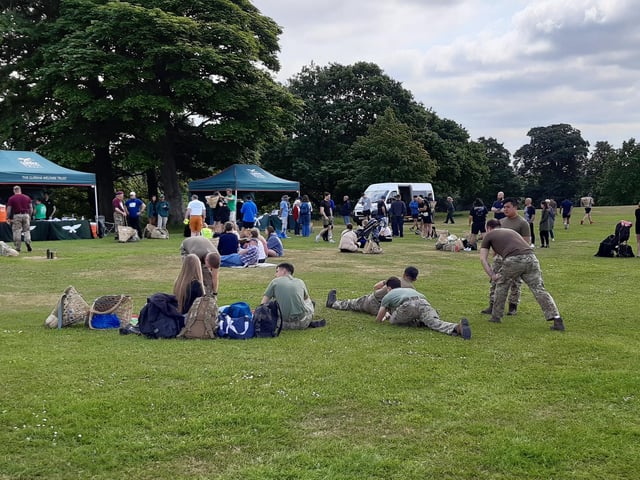 A group of competitors do their stretches before setting out.