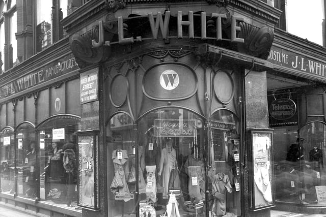To the left is 1-11 Queen Victoria Street, on the right 104/106 Briggate. This was the business of J.L.White, ladies clothing store. Displays can be seen in the shop windows, many signs for Telemac waterproof coats. This is now part of the Victoria Quarter. Pictured in September 1937.