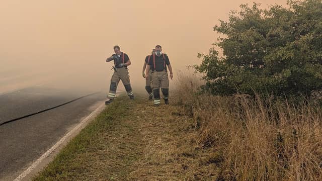 The fire at Langdale Moor, close to the RAF Fylingdales early warning base, has forced road closures and triggered warnings from the authorities for people to stay away.
