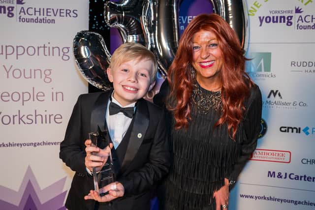 The picture shows Rocco receiving his award from a previous winner, Liz Green, on behalf of the sponsors, M & J Carter.