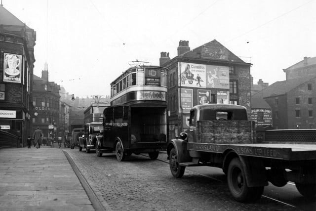 A number 10 tram to Compton Road is visible in this view looking north onto Briggate in November 1949.