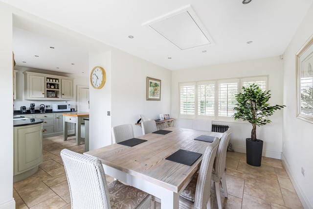 This spacious dining area adjoins the kitchen.