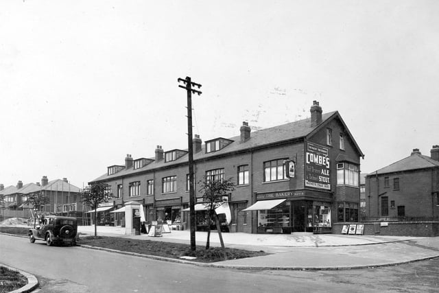 A row of shops on Easterly Road pictured in June 1935 looking from the junction with Gipton Wood Road. The parade of shops includes F.A Robson chemists, Beaumonts fruit shop and a bakery on the corner. A Tetley sign hangs above the bakery.