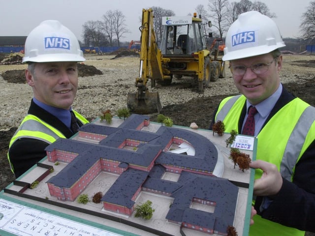 Mike Atkin, left, Chief Executive of Leeds Community and Mental Health Services Teaching NHS Trust and  Nigel Crisp, NHS chief Executive and Permanent Secretary for the Department of Health,  with a model of the new mental health services unit at Seacroft Hospital, in 2001.