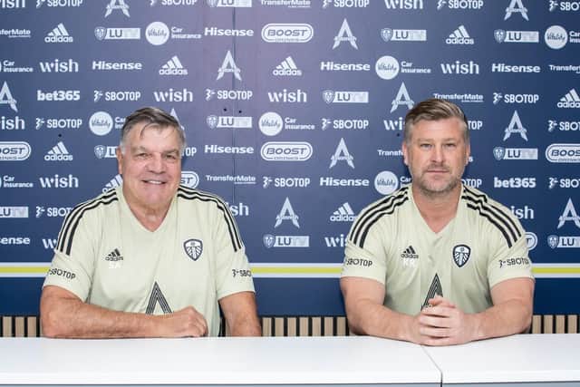 Sam Allardyce (L) and assistant Karl Robinson (R) pose for photographs at their unveiling as Leeds United's new managerial team
