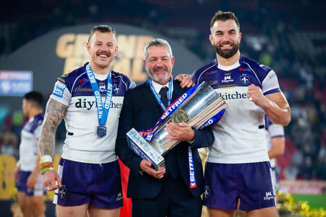 Wakefield Trinity coach Daryl Powell with Grand Final man of the match Tom Johnstone, left and captain Mike McMeeken, right of picture. Picture by Callum Pilkington/SWpix.com.