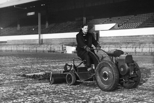 Helping to ease the Headingley turf with a drag chain in December 1963 is Leeds RL assistant groundsman Ralph Dockray.