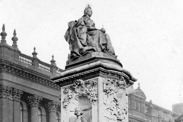 This view shows the Queen Victoria Memorial Statue when located outside Leeds Town Hall. Sculpted by George Frampton, it was unveiled in 1905, four years after the Queen's death. From a postcard with postdate August 12, 1907.