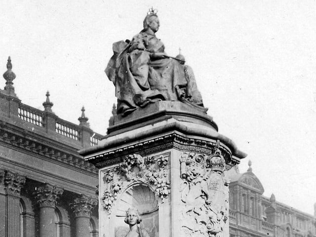 This view shows the Queen Victoria Memorial Statue when located outside Leeds Town Hall. Sculpted by George Frampton, it was unveiled in 1905, four years after the Queen's death. From a postcard with postdate August 12, 1907.