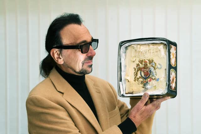 Leeds royalist Gerry Layton, 62, has already forked out twice to own the unique portion of marzipan cake  (Photo: Jonathan Gawthorpe)