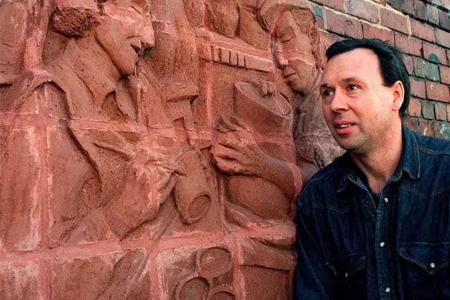 Harry Malkin, of Yorkshire Art Circus, with his sculpture mural on River View in October 1996.