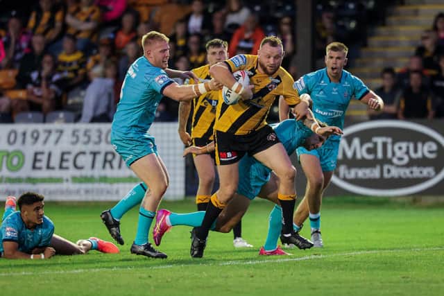 Brad Singleton on the attack for Castleford Tigers against Huddersfield Giants last season. Picture by Alex Whitehead/SWpix.com.