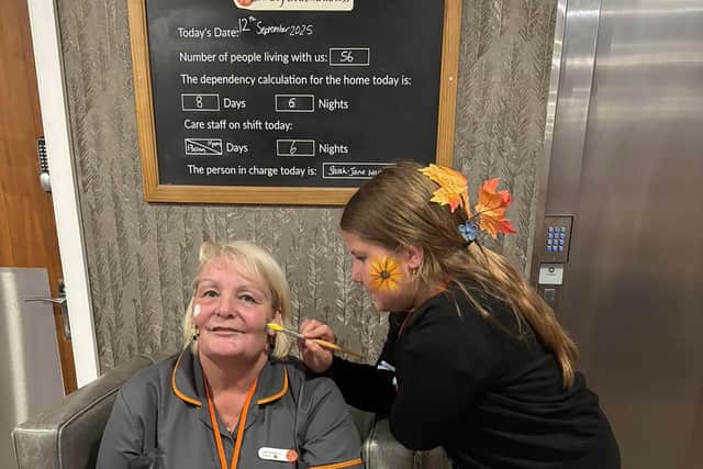 Colleague having their face painted at HC-One's Handley House Care Home’s Autumn Fayre