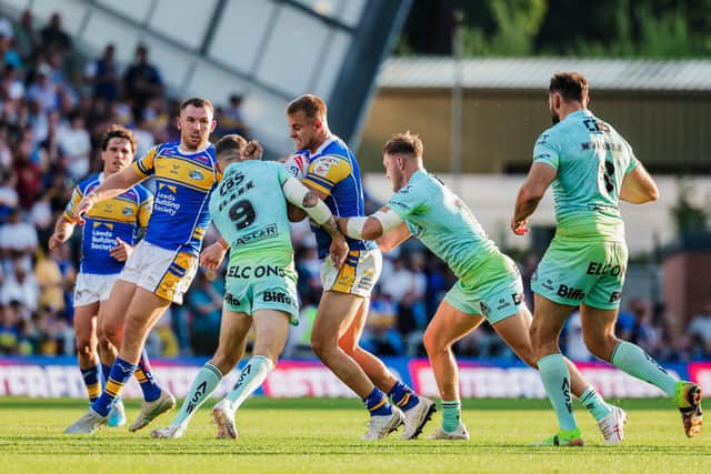 Cooper Jenkins, with ball, could return from injury for Leeds Rhinos at Hull FC today, but Cameron Smith, also on the picture, remains on the casualty list. Picture by Alex Whitehead/SWpix.com.