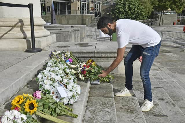 People from across Leeds have been laying flowers outside the Leeds Civic Hall and signing the city’s book of condolences. Picture: Steve Riding