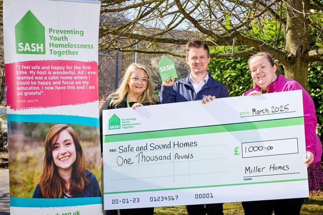 Representatives of SASH receive funds from Chris Carlin of Miller Homes Yorkshire