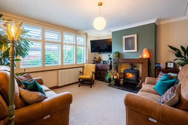 The living room at the front of the property has a log burner and is the perfect spot to cosy up on the sofa in the evening.